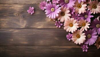 Bouquet of pink daisies on a wooden background. photo