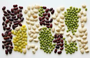 various types of beans on a white background. top view. photo