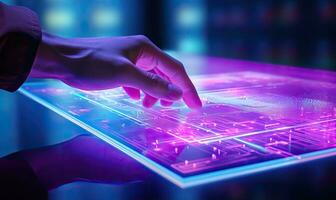 Close up of human hand using tablet pc with circuit board on the background photo