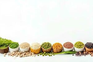 various legumes in wooden bowls and spoons on white background photo