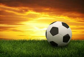 Soccer ball on sunset photo