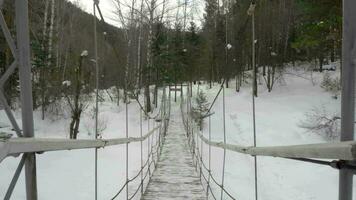 Cable suspension Bridge over Belokurikha river, winter video