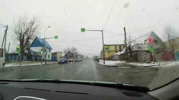 NOVOSIBIRSK, RUSSIA OCTOBER 31, 2021 - POV view car driving on an autumn rainy day. Driving in bad autumn winter weather video