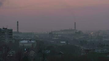 Panoramic view, time lapse of a sunset in an industrial city video