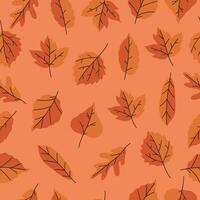 Seamless pattern with autumn leaves in orange colors. Vector graphics.