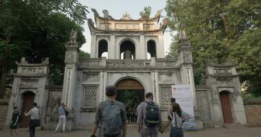 People at the Temple of Literature main gate in Hanoi, Vietnam video