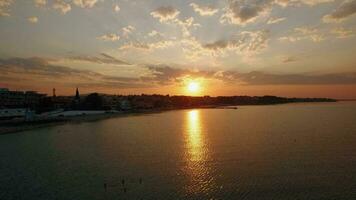 Sunrise aerial panorama of coastal resort town Nea Kallikratia, Greece video