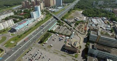 An aerial view of a busy highway in the middle of a city district video