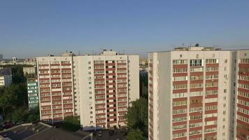 An aerial view of three similar looking multi storey buildings video