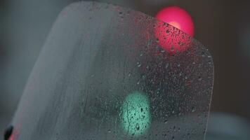 Traffic lights view through wet glass video