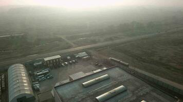 An aerial view of warehouses near the suburban road video