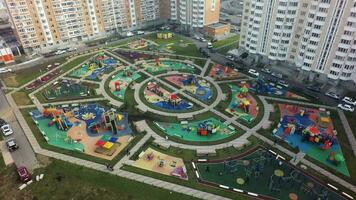 An aerial view of a large playground area in a residential microdistrict video