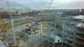 An aerial view of a large construction site next to a busy highway video