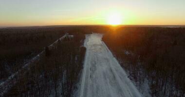 A snowy road in a forest video