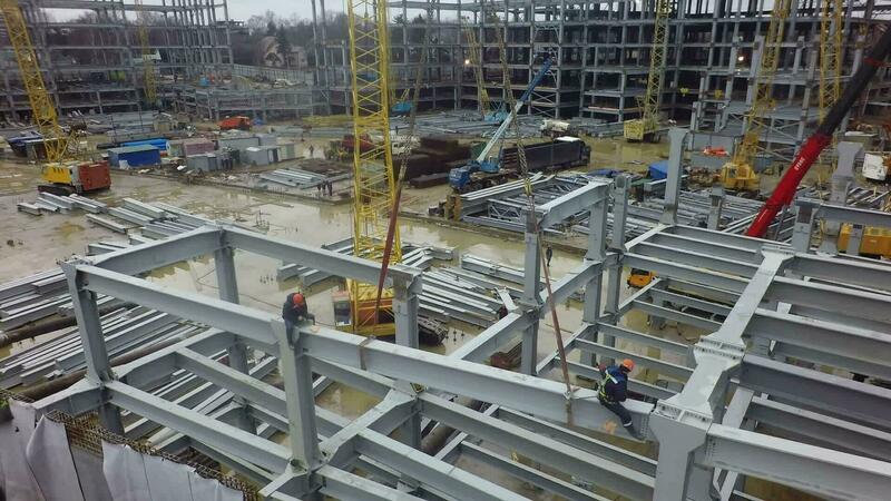 Steel structures of industrial buildings at construction site, aerial view 28043789 Stock Video at Vecteezy