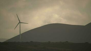 A monochrome view with a wind generator video