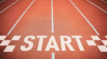 Start point on Running track. Concept of business competition, planning for business startup, strategies, and challenges or career paths with opportunities and changes. photo