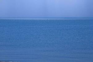 calm blue sea landscape with cloudless sky and water photo