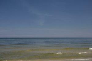 calm blue sea landscape with cloudless sky and water photo