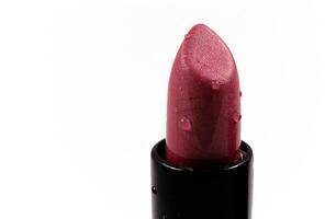 red lipstick in a black body on a white isolated background photo