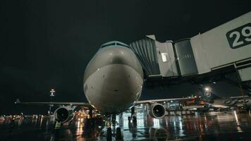 Korean Air aircraft with boarding bridge, night view at Sheremetyevo Airport video