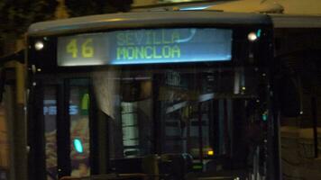 Bus traveling through the night city Madrid, Spain video