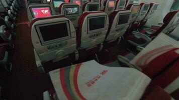 Empty cabin of Hainan Airlines plane Seats and working monitors video