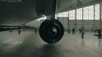 Back view on jet turbine in repair hangar video