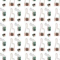 Seamless pattern with vintage photo cameras vector