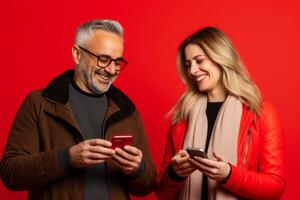 woman and man with phone on red background. photo