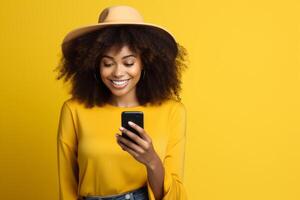 woman with phone on yellow background . photo