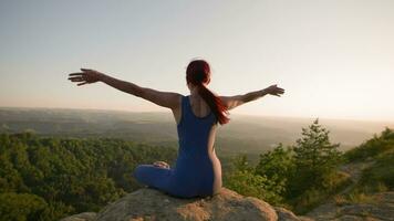 Yoga Session in the Mountains. Young Athletic Woman Exercising in the Rocky Mountains During Sunrise, Doing Various Yoga Poses - Healthy Lifestyle and Zenism Concept. Slow Motion. video