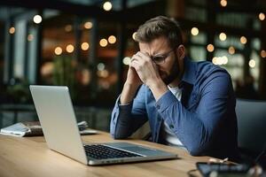 Stressed business man sitting at office workplace. Tired and overworked student man. Young exhausted men in stress working on laptop computer. AI Generated photo