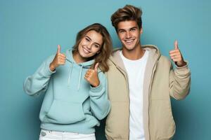 Portrait of teenagers showing thumb-up on blue background. AI Generated photo