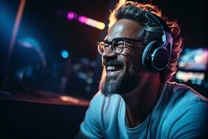 Positive emotions. Man in glasses is sitting by the laptop in dark room with neon lighting. AI Generated photo