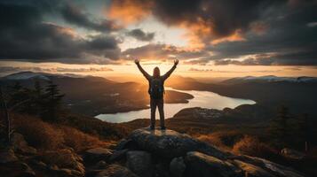 Success man hiker hiking on sunrise mountain peak. photo