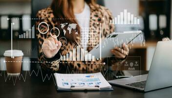 Intelligence and business analytics with dashboard concept.Website designer working in come digital tablet computer laptop.and smart phone. in office photo