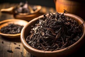 Dried tea leaves macro closeup. Dried tea leaves on a wooden table. Selective focus. photo