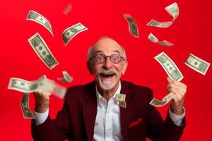senior man and flying money on studio red background. photo