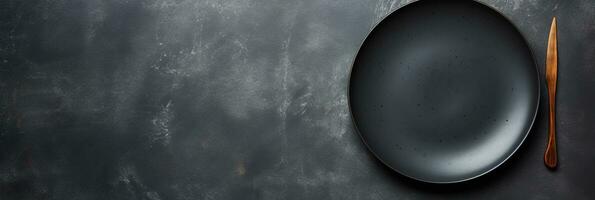 An empty black plate with cutlery on a dark concrete back. AI Generated photo
