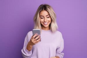 woman with phone on purple background . photo