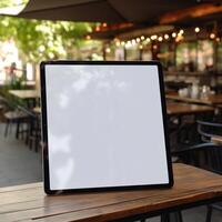 High quality photo of big tablet with blank screen on the table, perfect to create mockup preview