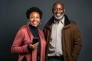 attractive mature black woman and black man with phone on studio color background. AI Generated photo