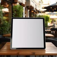 High quality photo of big tablet with blank screen on the table, perfect to create mockup preview