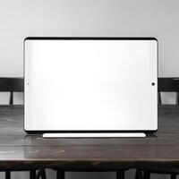 High quality photo of big tablet with blank screen on the table, perfect to create mockup preview