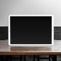 High quality photo of big tablet with blank screen on the table, perfect to create mockup preview