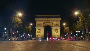 arco Delaware triunfo, París iluminado a noche foto