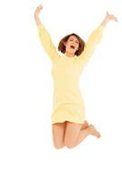 Smiling adult woman jumping with hands up photo