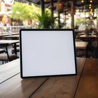 High quality photo of big tablet with blank screen on the table, perfect to create mockup preview