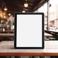 High quality photo of big tablet with blank screen on the table, perfect to create mockup preview